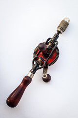 old vintage drill for carpenter, tool on the white background