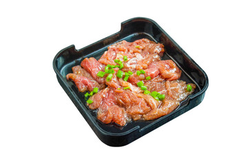 Fermented pork on black plate isolated on white. Clipping path. Shabu Shabu ingredient.