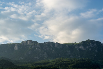 Fototapeta premium Beautiful nature mountain top view with sky and clouds