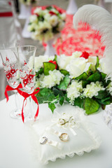 beautiful, gorgeous wedding decoration in red and white, flowers, wedding rings