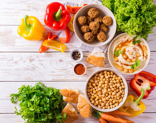 Falafel, pita, hummus and chickpea  with vegetables. Top view