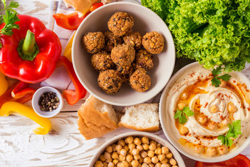 Falafel, pita, hummus and chickpea  with vegetables. Top view