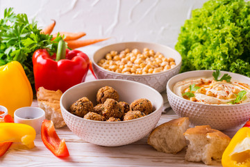 Falafel, pita, hummus and chickpea  with vegetables. horizontal view
