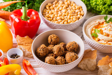 Falafel, pita, hummus and chickpea  with vegetables. horizontal view