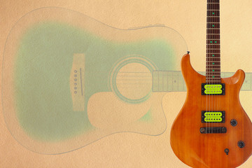 Electric guitar with green pickups and acoustic jumbo guitar on the creamy cardboard background,...
