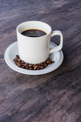 Black Coffee in a white cup set and coffee been