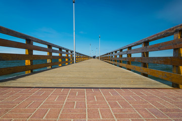 Wooden pier on the embankment of the Baltic Sea in the Kaliningrad Region