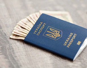 hryvnia in the Ukrainian passport. Ukrainian money in international biometric passport.