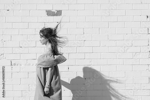 Profile Of A Woman With Flowing Hair On The Background Of A