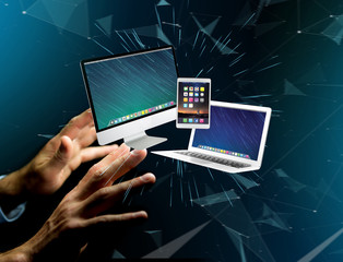 Computer and devices displayed on a futuristic interface with business network - Multimedia and technology concept