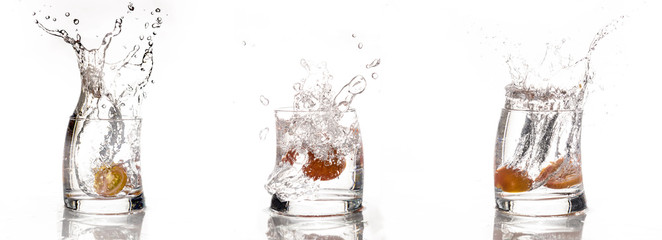 Tomato falls in a glass of water - Splash