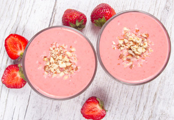 Strawberry smoothie with fresh fruit .