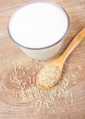 Rice milk on the wooden background .