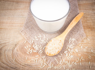 Rice milk on the wooden background .