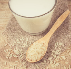 Rice milk on the wooden background .