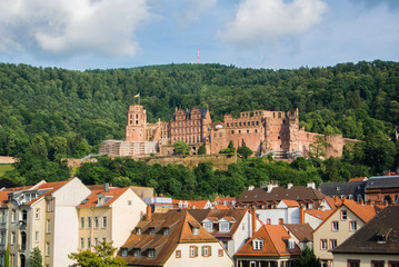 Panoramic view of Heidelberg castle over the tile roofs of old town from Carl Theodor bridge, Heidelberg, Germany.