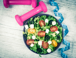 Greek salad with fresh vegetables, feta cheese and black olives.