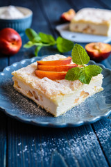 Dessert made of two puff pastry layers filled with mascarpone cream and nectarine