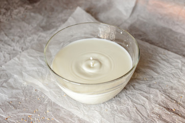The milk is poured in a glass dish.
