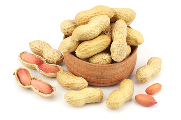 peanuts in wood bowl isolated on the white background