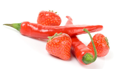 Hot chili peppers and sweet strawberry