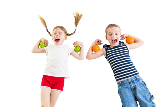 happy kids with apples and oranges