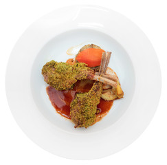 Grilled rack of lamb with pistachio in plate, isolated on white