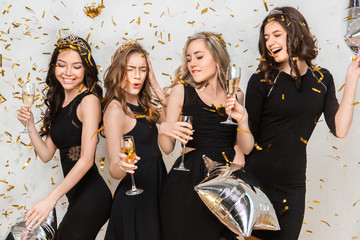  Young women together celebrating hen party isolated on white