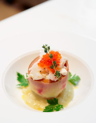 Gourmet appetizer with artichoke, seafood, and salmon roe