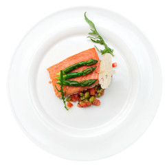 Slow cooked salmon steak in plate, isolated