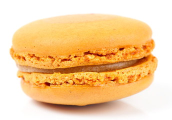 Yellow macaron isolated on white background