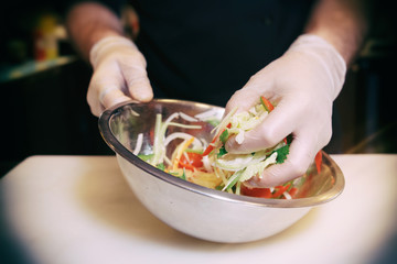 Chef is cooking a vegetarian salad, toned image