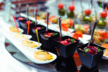 Various snacks on table, toned