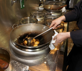 Doughnuts being fried in oil