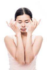 Beautiful young Asian woman applying facial moisturizer cream for sensitive skin care