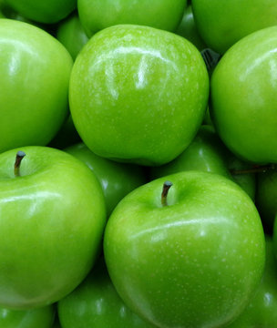 Closed up Heap of Vivid Color Green Apples, Vertical Photo for Background, Banner 