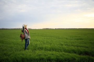 Naklejka na ściany i meble Freedom woman in grass green field, space, sky, nature, natural background