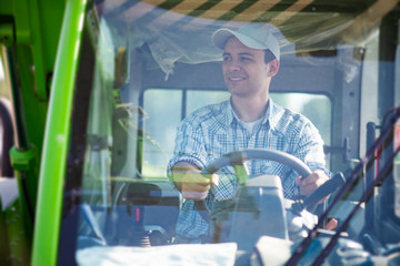 Farmer driving a tractor © Minerva Studio