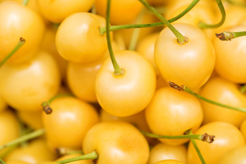Naklejka na ściany i meble Fresh yellow cherry as a background. Selective focus