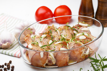 Marinated chicken. Raw chicken leg marinated with soy sauce, garlic, spices and herbs. Close-up.