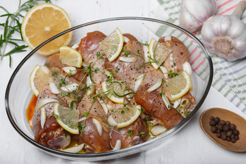 Marinated chicken. Raw chicken leg marinated with soy sauce, garlic, spices and herbs. Close-up.