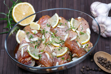 Marinated chicken. Raw chicken leg marinated with soy sauce, garlic, spices and herbs. Close-up.