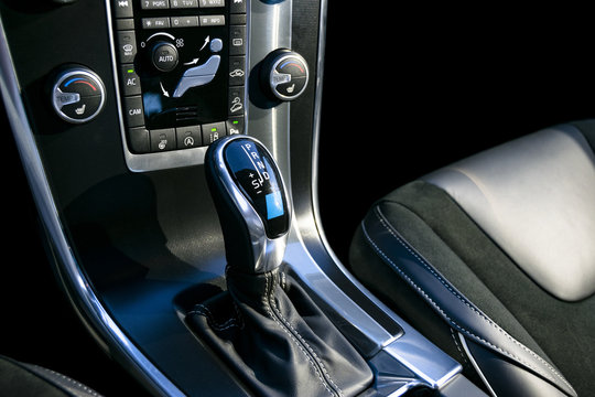 Automatic gear stick of a modern car, car interior details with electronic components