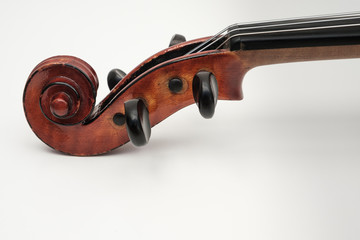 Fototapeta na wymiar CLose up view of a violin with white plain background.