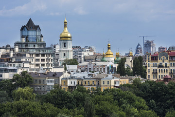 Capital of Ukraine, Kiev. Old and modern architecture of Kiev, Ukraine. City landscape of capital city with gold church