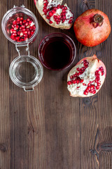 red pomegranate juice and sliced fruit on wooden background top view mockup