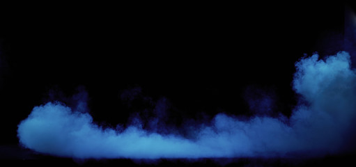 Blue smoke swirling in the grungy, dark interior