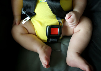 Buckle up!
Baby save protection contest with unfasten seat belt in car seat.