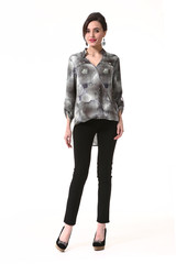 Fototapeta premium fashion indian business woman in formal blouse black jeans high heel shoes full body photo isolated on white