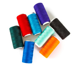 colorful sewing thread isolated on white